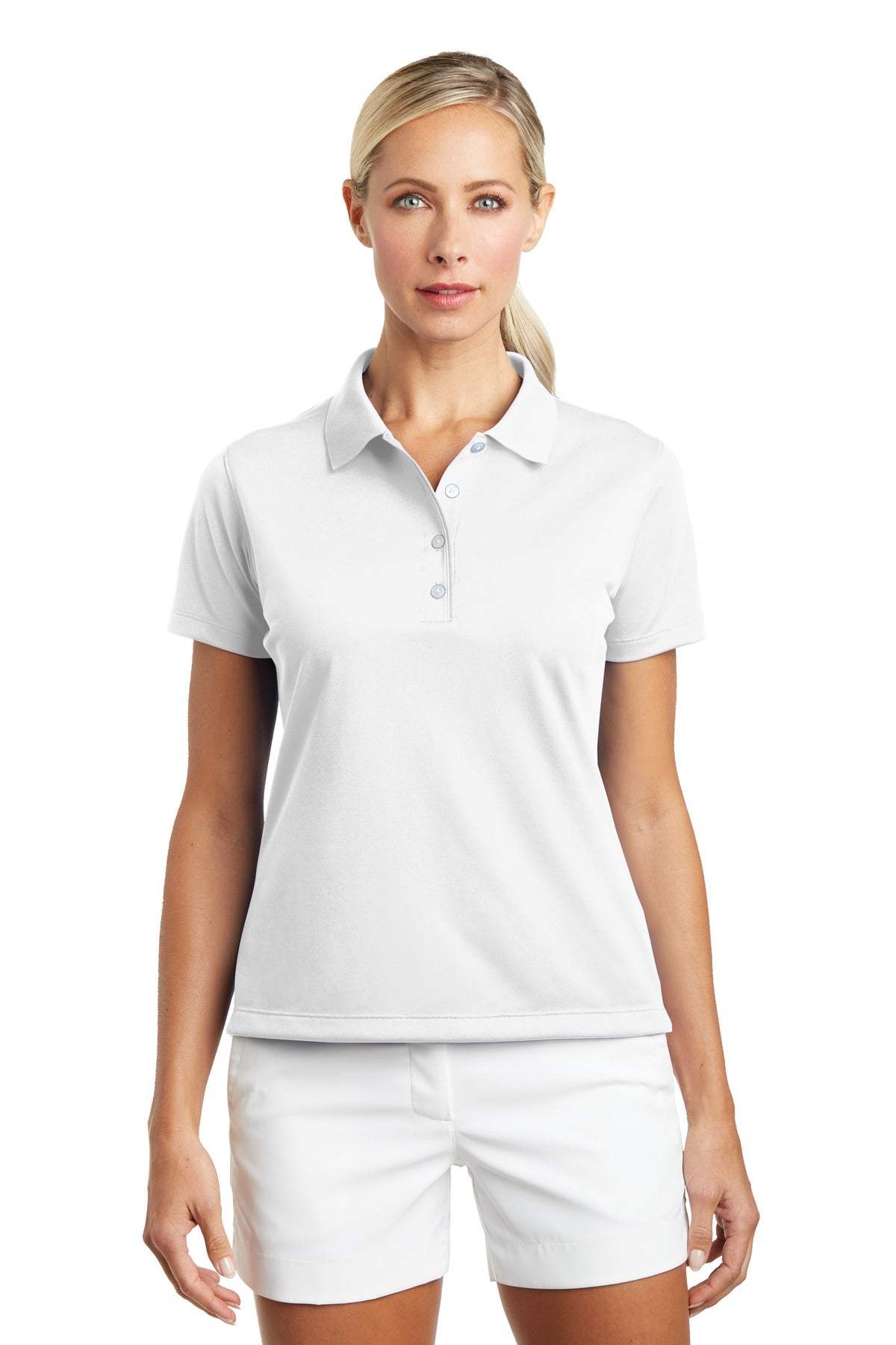 White Nike Women's Tech Basic Dri-FIT Polo shirt worn by a model, showing the front view with short sleeves and collar.