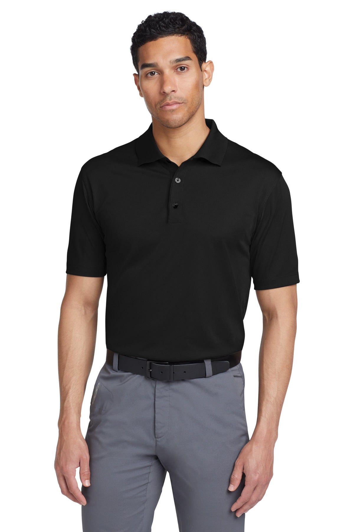 Black Nike Tech Basic Dri-FIT polo shirt worn by a model, front view showcasing the athletic fit and Nike logo.