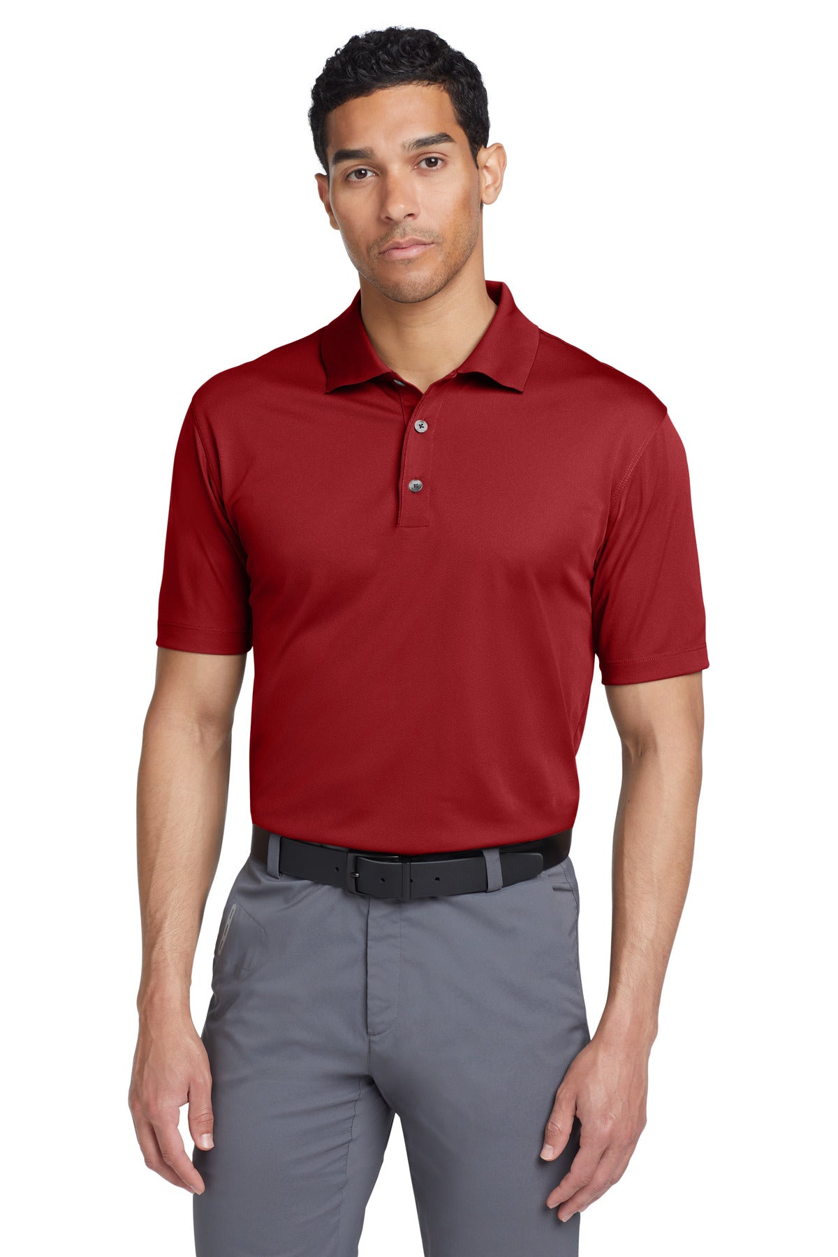 Red Nike Tech Basic Dri-FIT polo shirt shown from the front, featuring a classic collar and Nike logo on the chest.