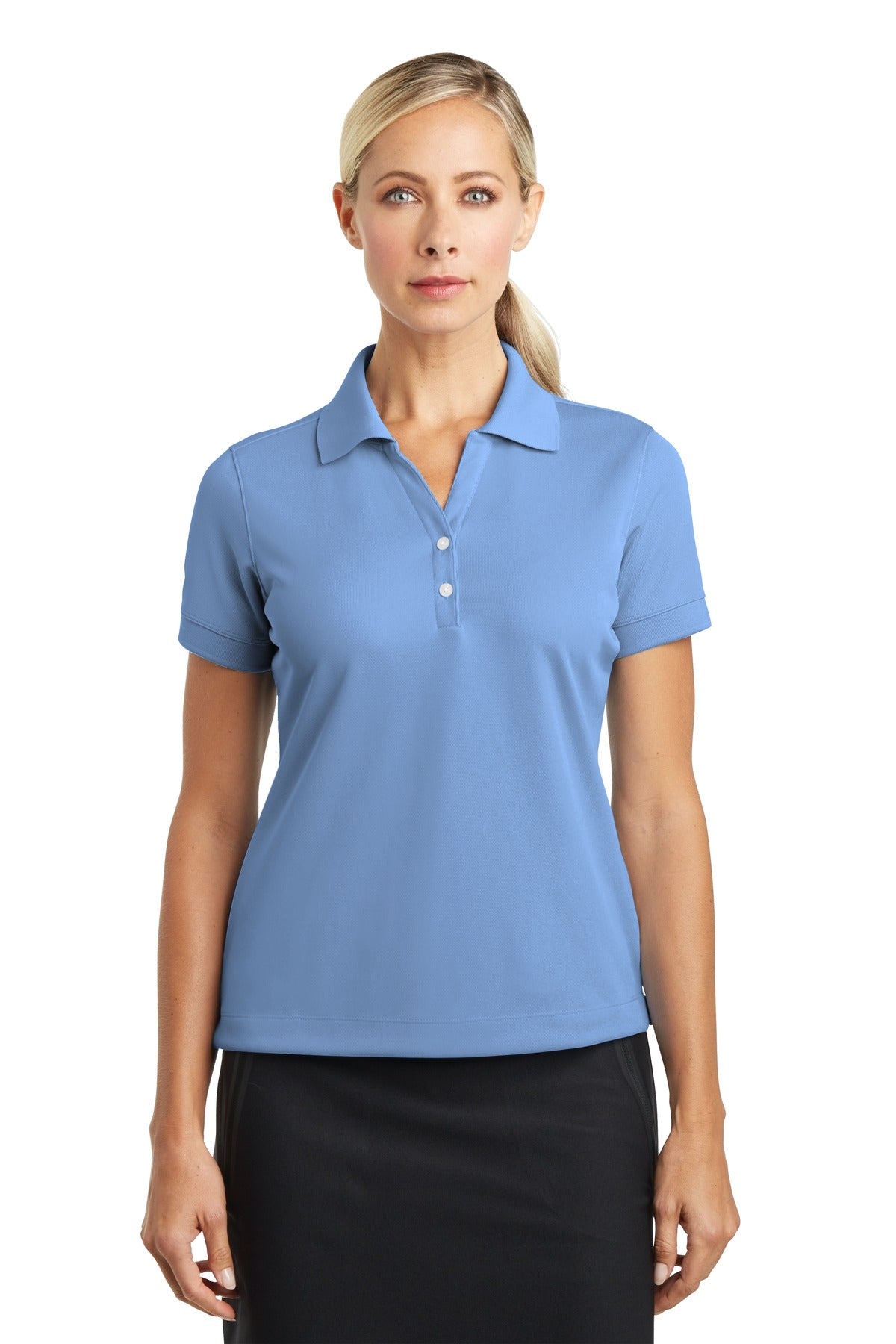 Light blue Nike Women's Dri-FIT Classic Polo shirt on a model, front view showing breathable fabric and collar detail.