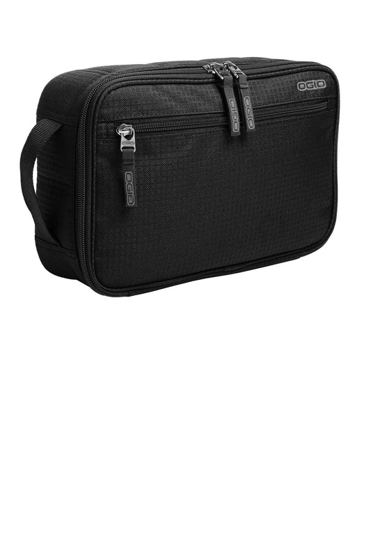 OGIO Shadow Travel Kit in black, flat front view showing compact toiletry bag with zipper and multiple compartments for travel organization.