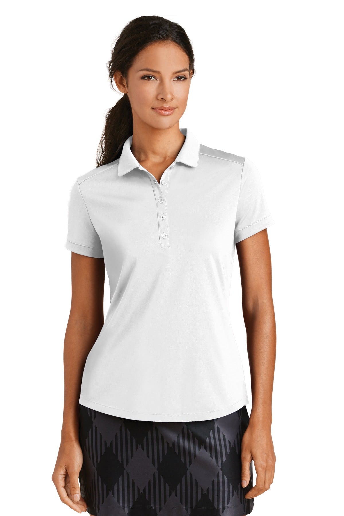 White Nike Women's Dri-FIT Players Modern Fit Polo shirt worn by a model, front view showcasing the athletic fit and polo collar.