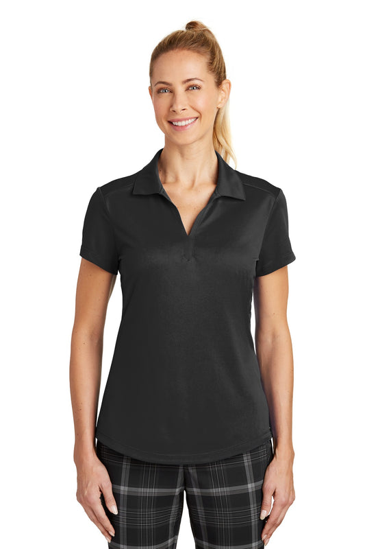 Black Nike Women's Dri-FIT Legacy Polo shirt worn by a model, showing the front view with Nike logo and polo collar.