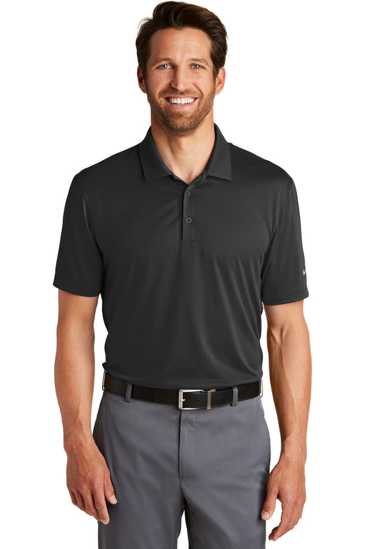 Black Nike Dri-FIT Legacy Polo shirt worn by a model, front view showing breathable athletic fabric and classic polo design.
