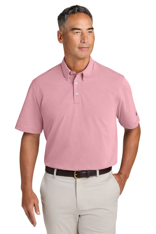 Brooks Brothers crimson pinpoint pique dress polo shirt displayed on a model, front view showing collar and button placket.