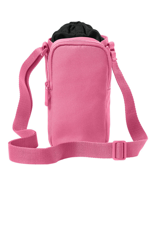 Port Authority matte oxford hydration crossbody bag in awareness pink, front view showing adjustable strap and logo detail.