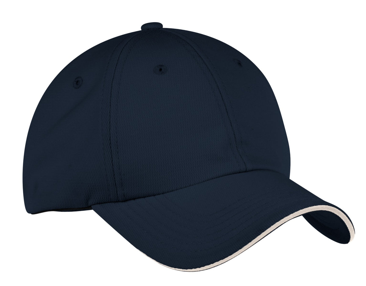 Port Authority Dry Zone cap in classic navy and stone, front view showing adjustable strap and embroidered logo.