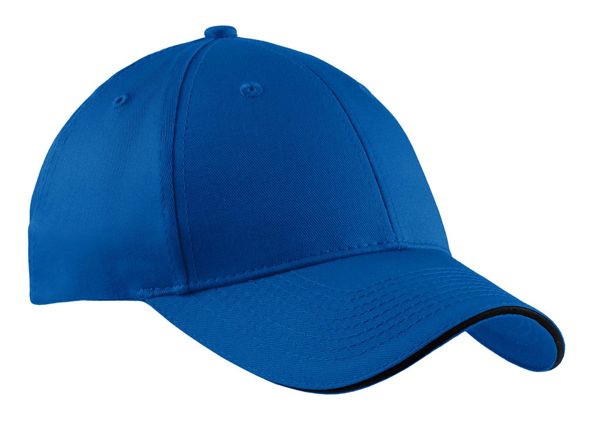 Royal blue Port Authority cotton twill sandwich bill cap with a flat front and adjustable strap, stylish and comfortable for everyday wear.
