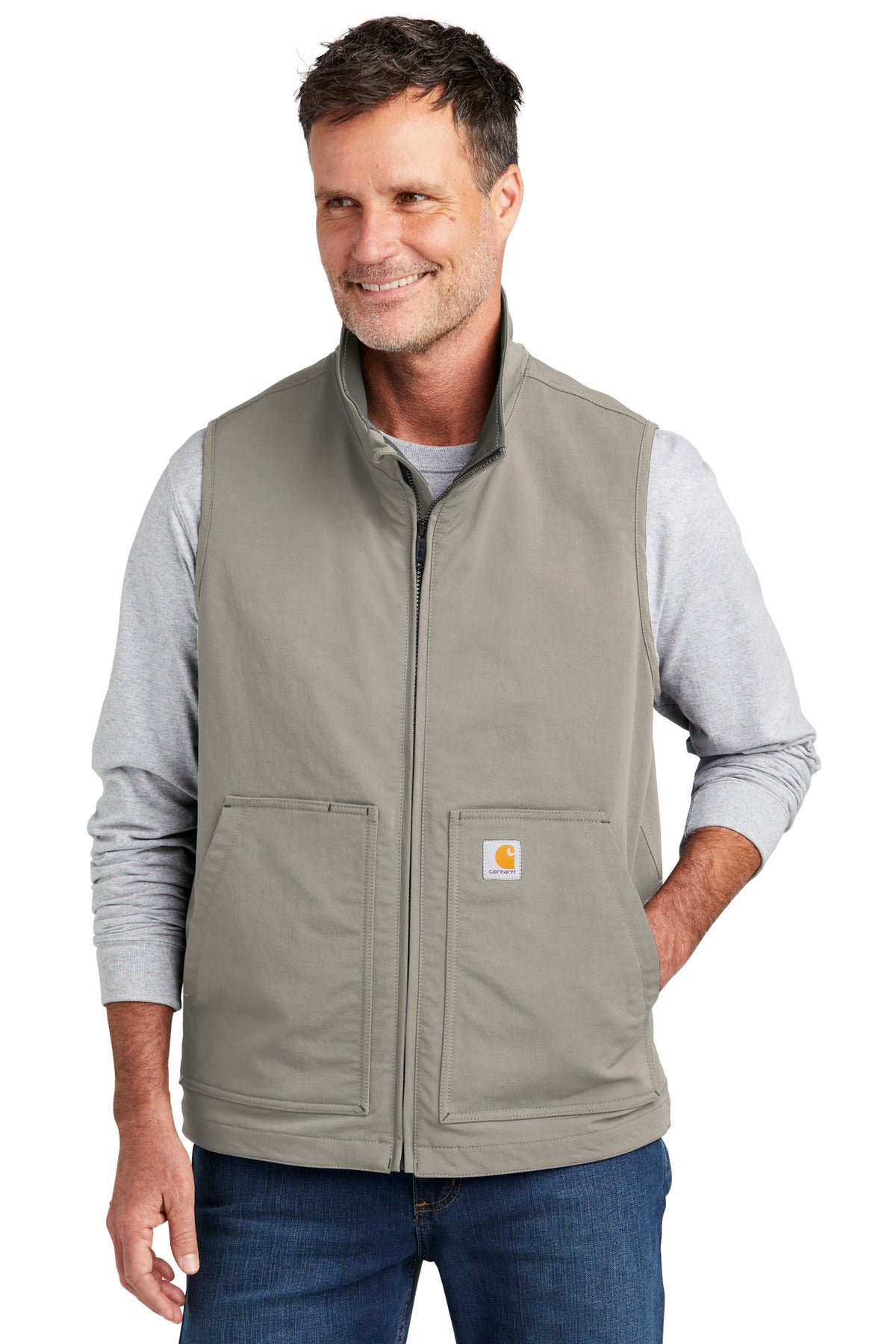 Carhartt Super Dux soft shell vest in greige, model wearing front view showing lightweight, durable outdoor vest design