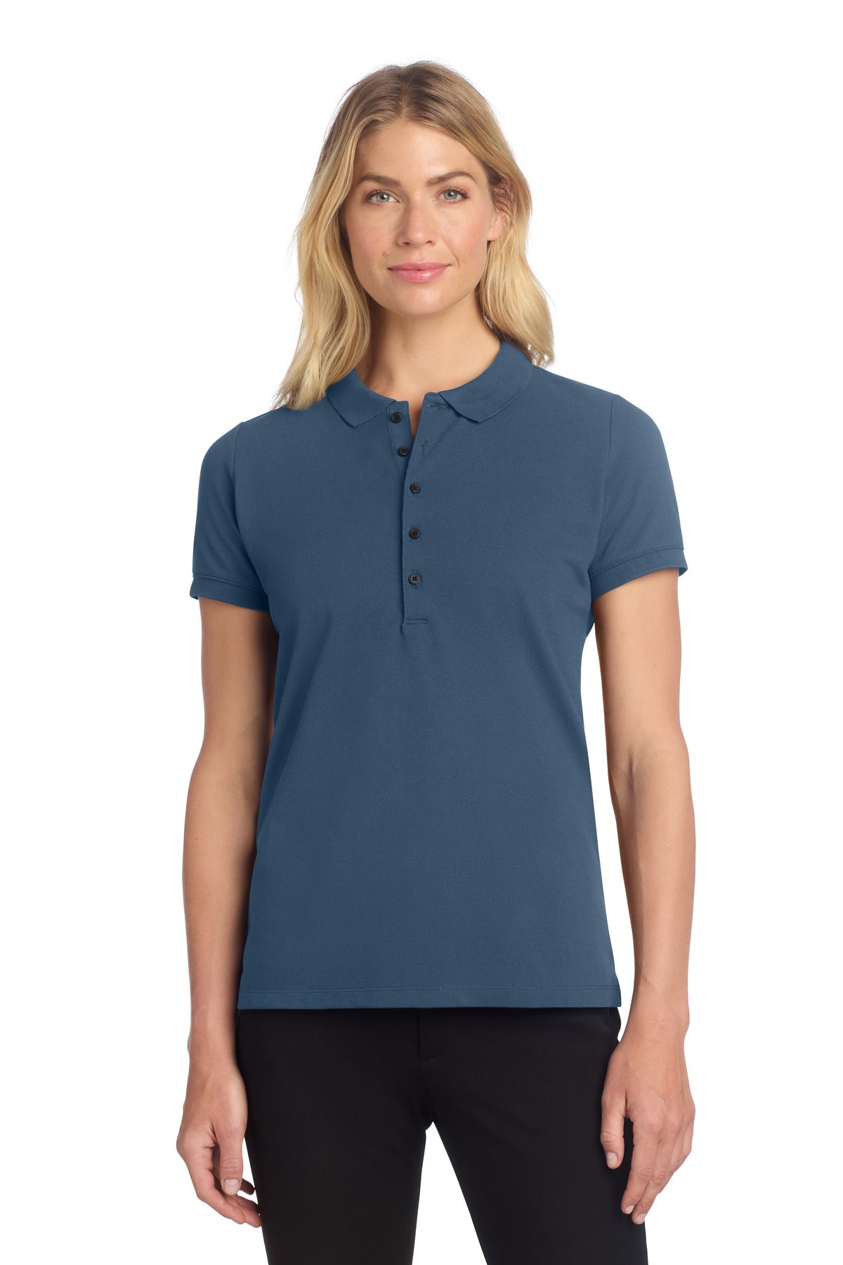 Front view of a woman wearing Mercer+Mettle Women's Stretch Heavyweight Pique Polo in insignia blue, showcasing the fitted design.