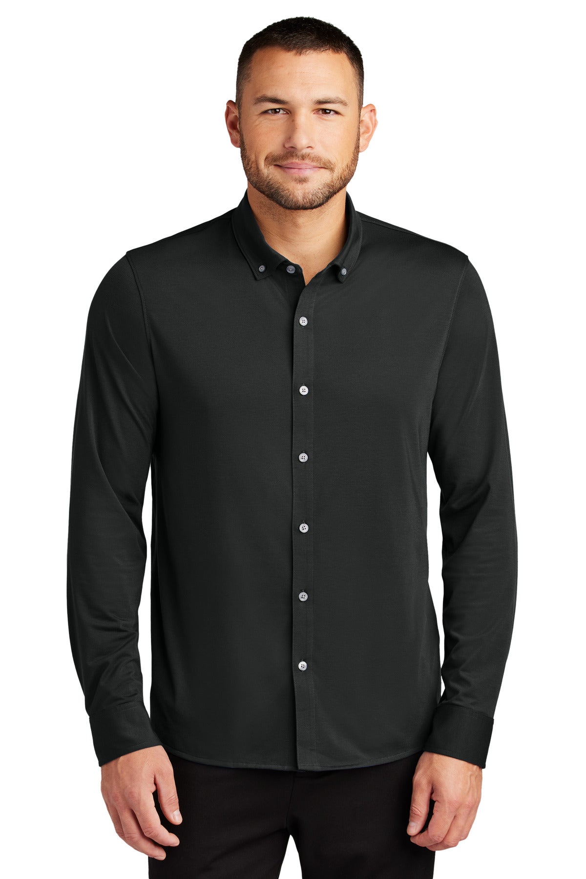 Mercer+Mettle stretch jersey long sleeve shirt in deep black, front view on male model showing fit and fabric texture.