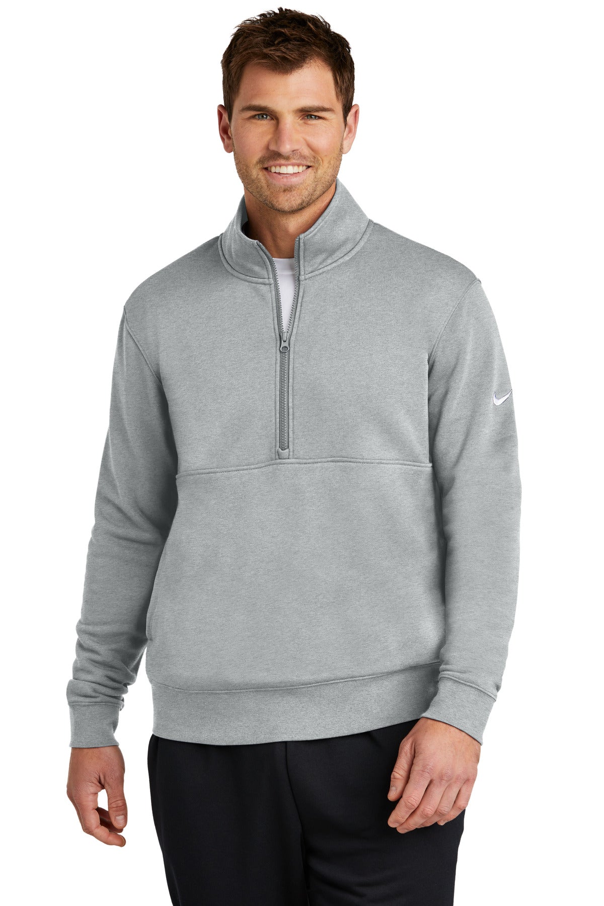 Nike Club Fleece half-zip jacket in dark grey heather with Swoosh logo, front view on a model.