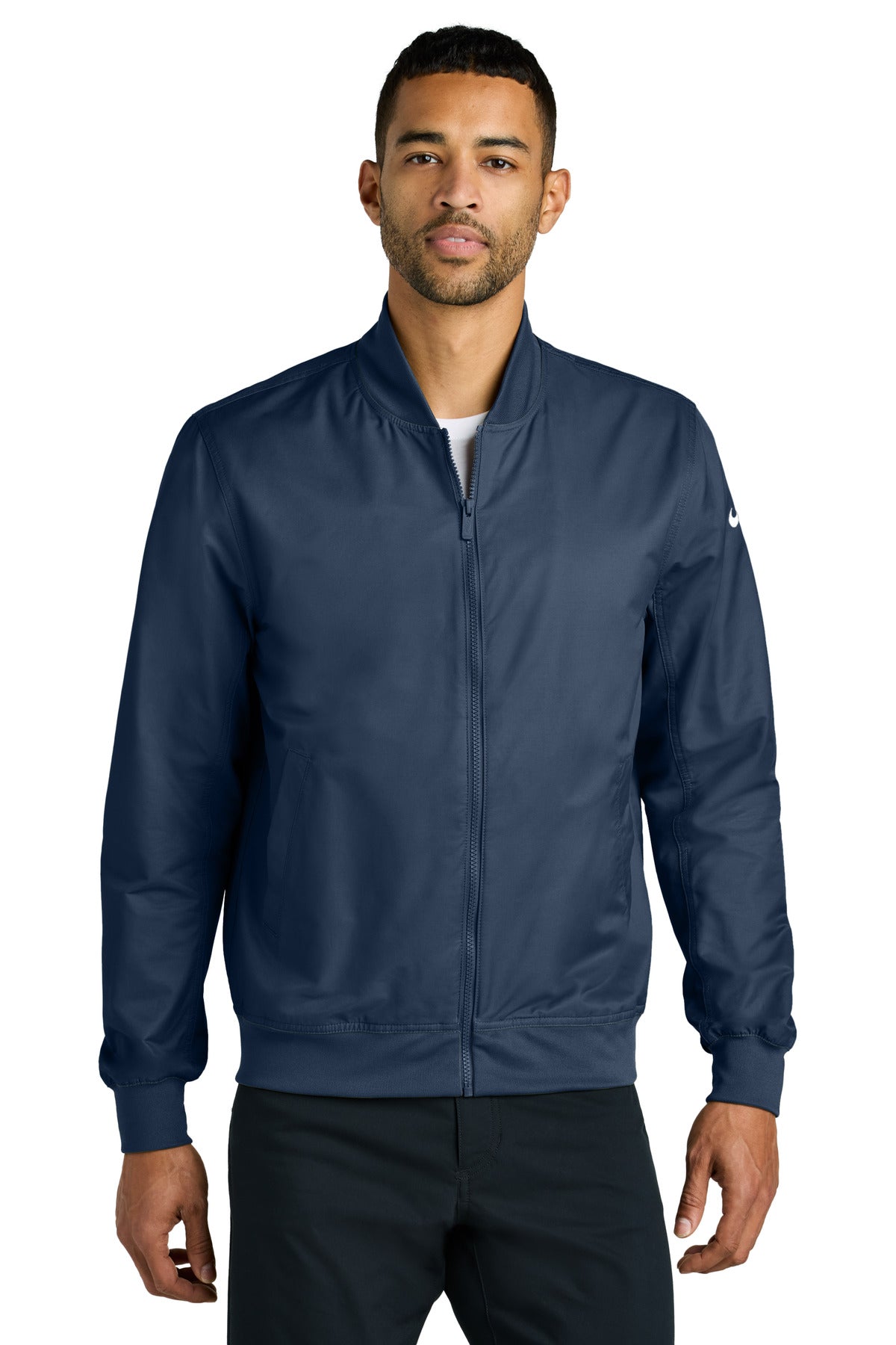 Nike bomber jacket in midnight navy, front view showing lightweight fabric, ribbed cuffs, and classic sporty design.