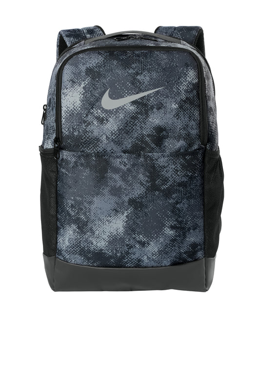 Nike Brasilia Camo backpack in iron grey with front zipper pocket and adjustable straps, durable and stylish for everyday use.